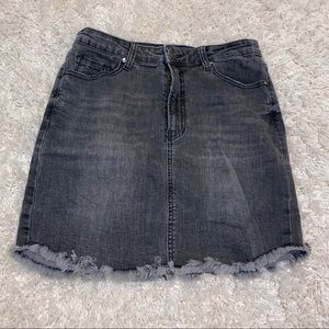 Distressed black jean skirt